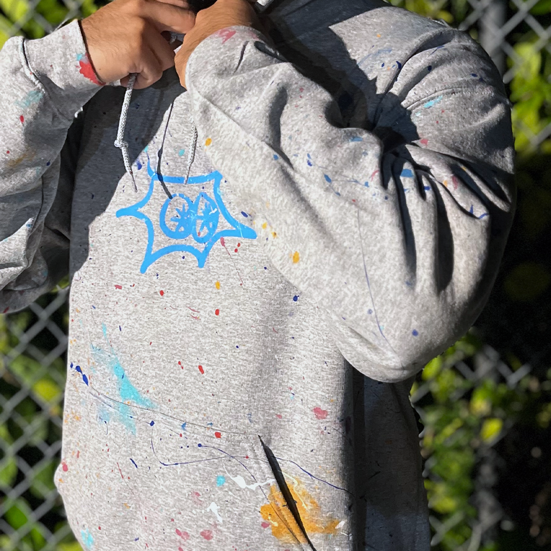 View jbluery latest murals, sculptures, and art projects! Shop now and purchase this hoodie from launch v1! Sport grey featuring maritime blue astro is hand-painted by jbluery! First come first served! Model: Jesse A. Sanchez