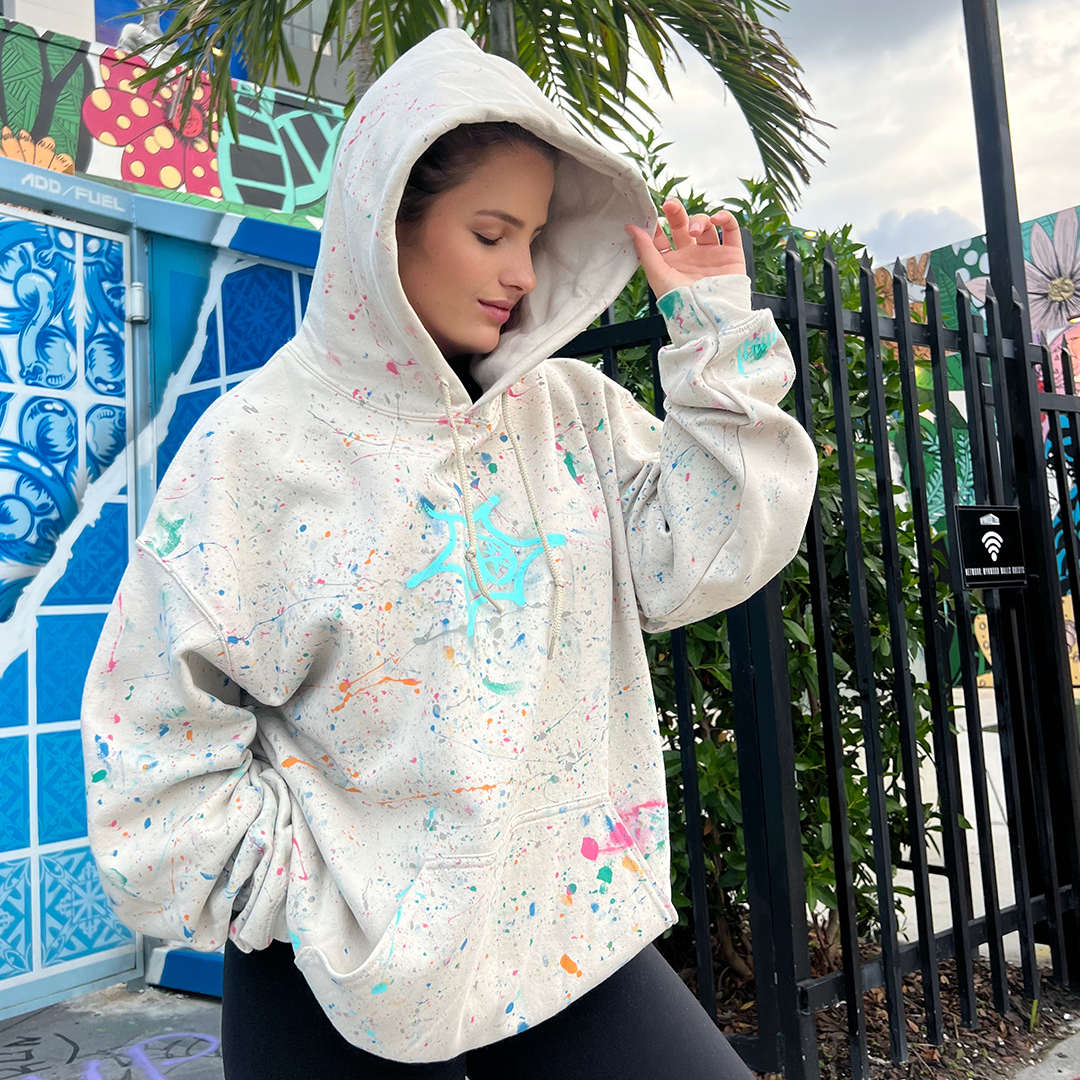 View jbluery latest murals, sculptures, and art projects! Shop now and purchase this hoodie from launch v1! Sand featuring turks teal astro is hand-painted by jbluery! First come first served! Model: Morgane Petit